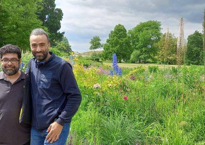 Majdi with Mich Belkhir in Hanover Germany posing for photo in front of park